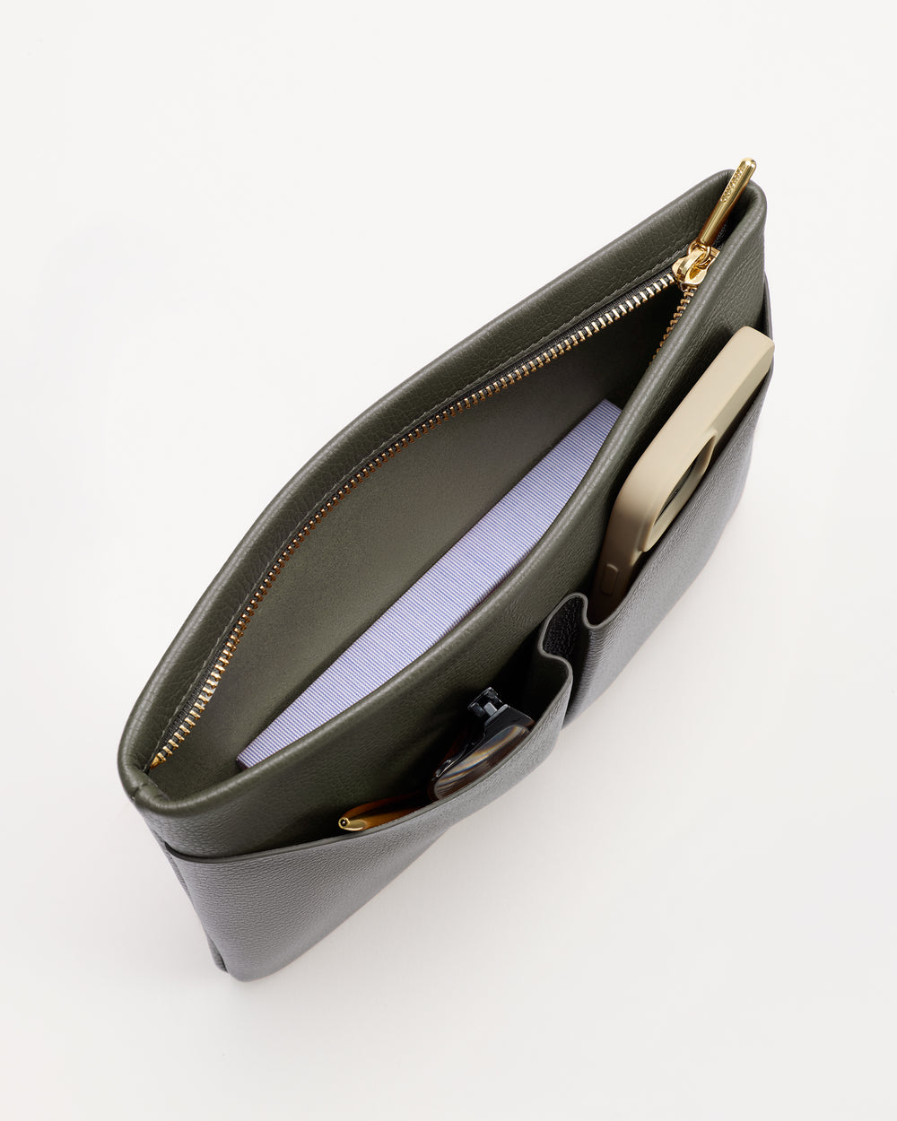 Open purse with zipper, showing contents like a smartphone and folded paper.