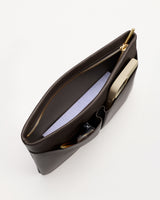 An open leather pouch with items inside and a zipper closure.