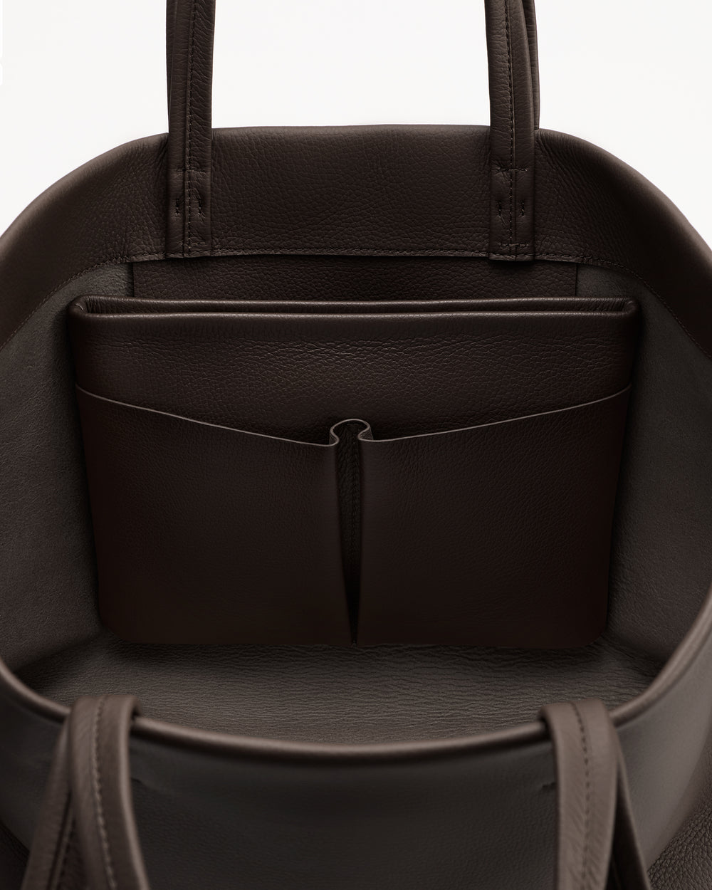 Open bag with pockets and handles visible.