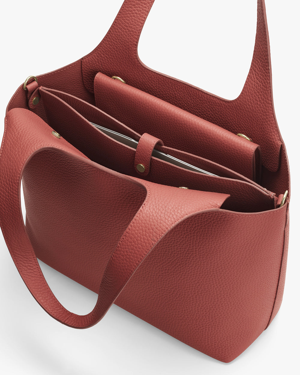 Open tote bag with wide handles and multiple compartments inside