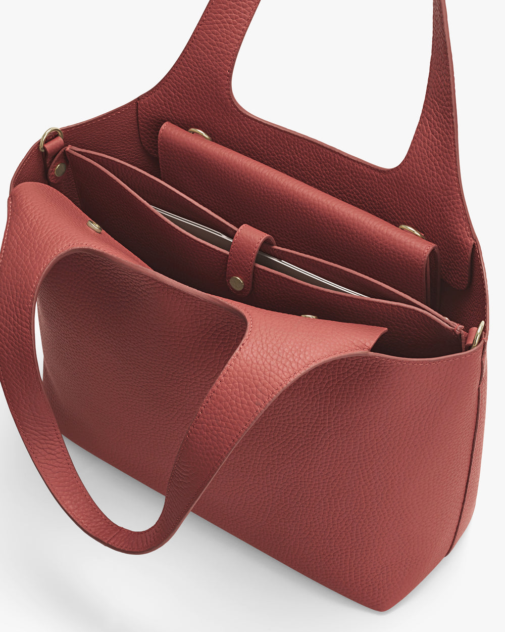 Open tote bag with multiple compartments and a flap inside.