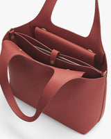Open tote bag with multiple compartments and a flap inside.