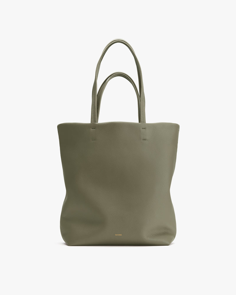 Tote bag with two handles on a plain background.
