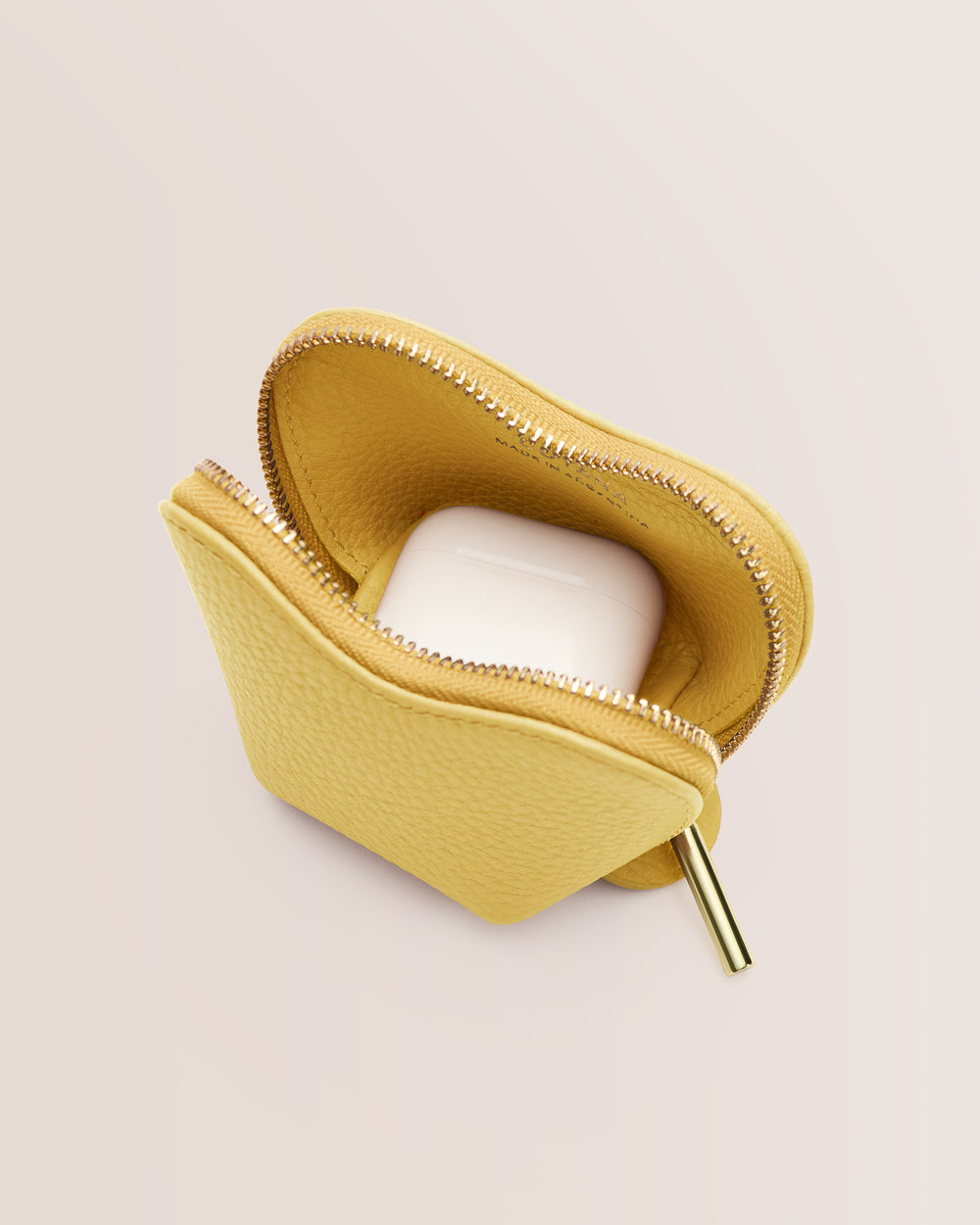 Small pouch with zipper partially open showing earbud case inside.