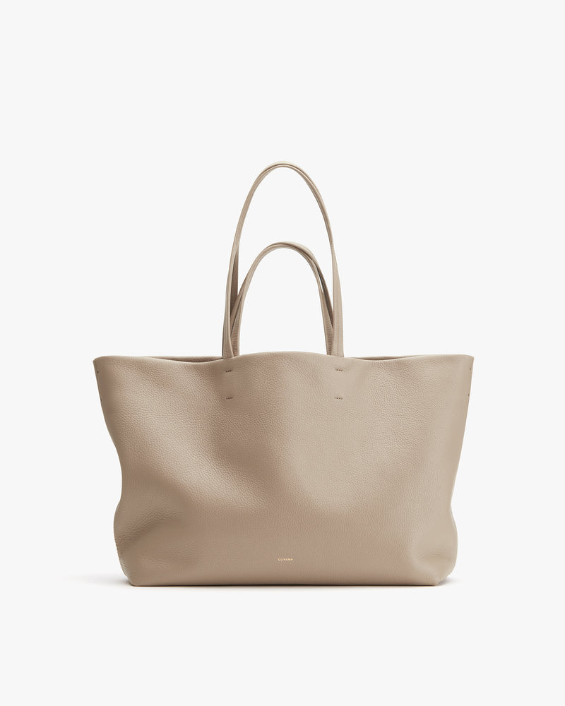 Tote bag with dual handles on display.