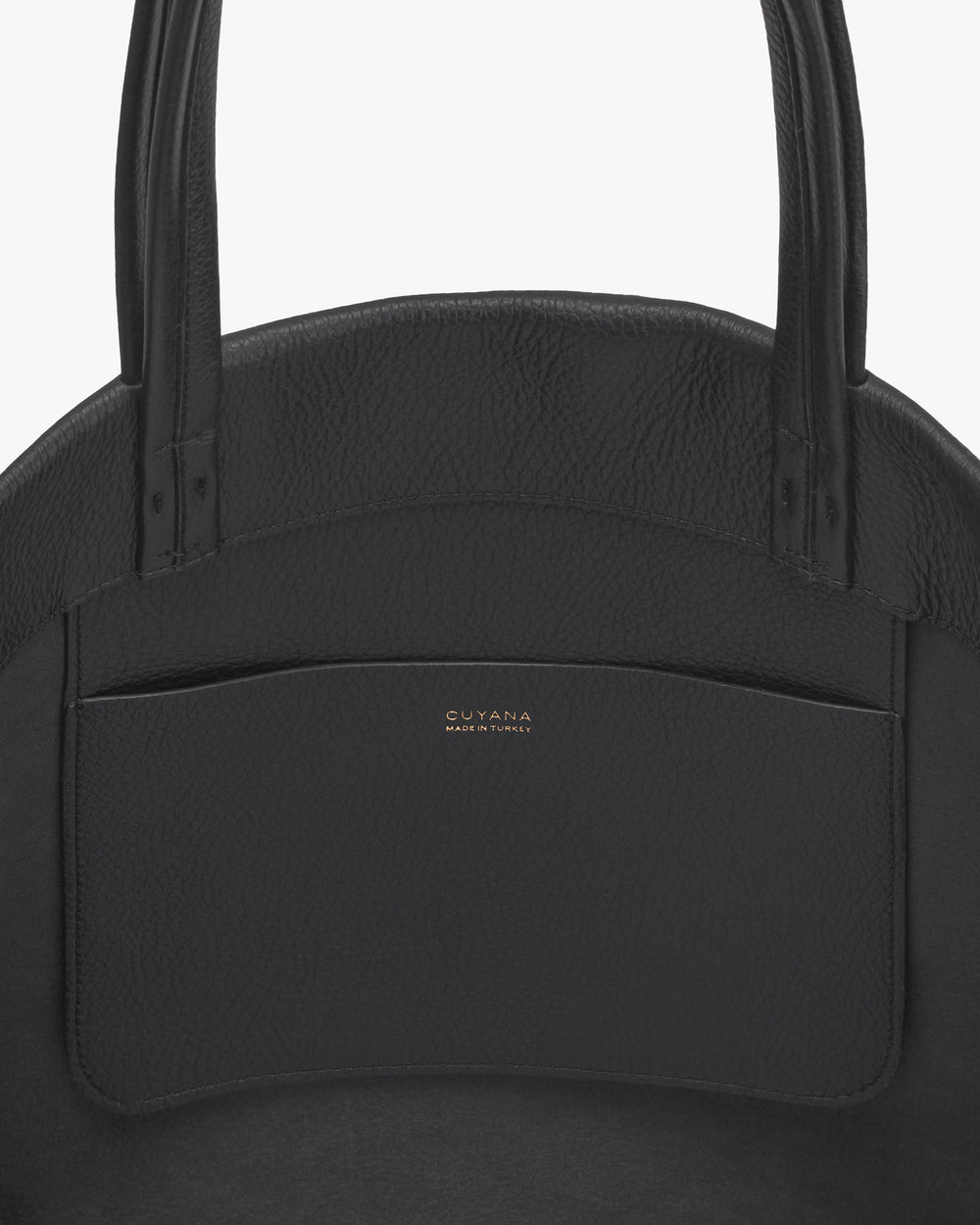 Close-up of a textured tote bag with a front pocket.