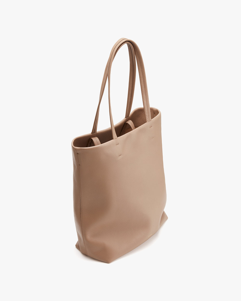 Tote bag with long handles on a plain background.