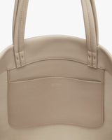 Tote bag with exterior pocket and shoulder straps.