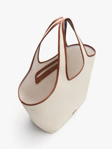 A large tote bag with dual straps viewed from above.