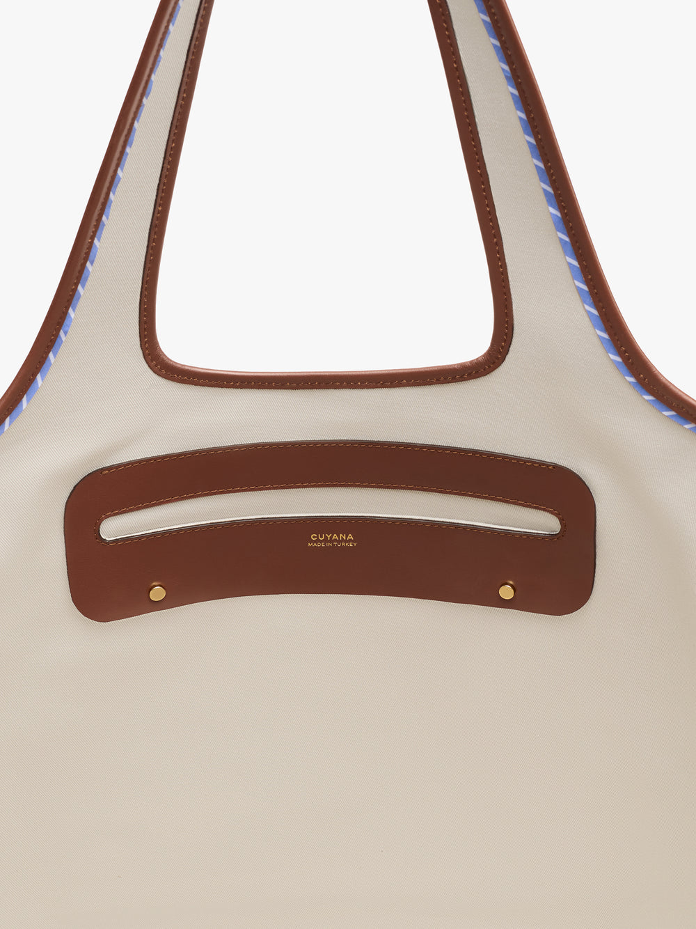 Tote bag with cut-out handle and stitching detail.