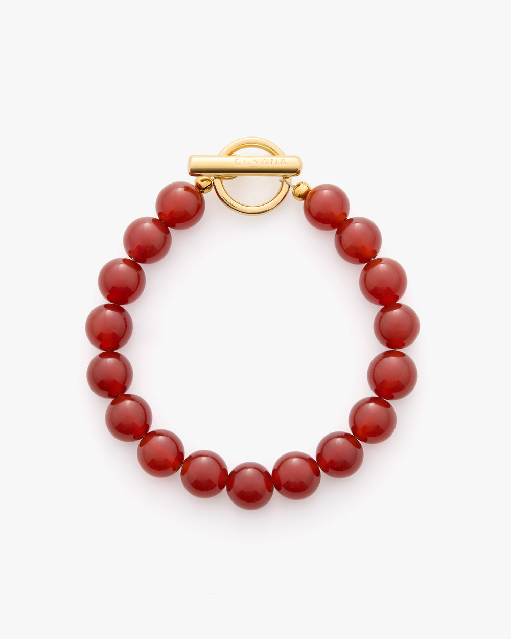Beaded bracelet with round beads and a circular clasp.