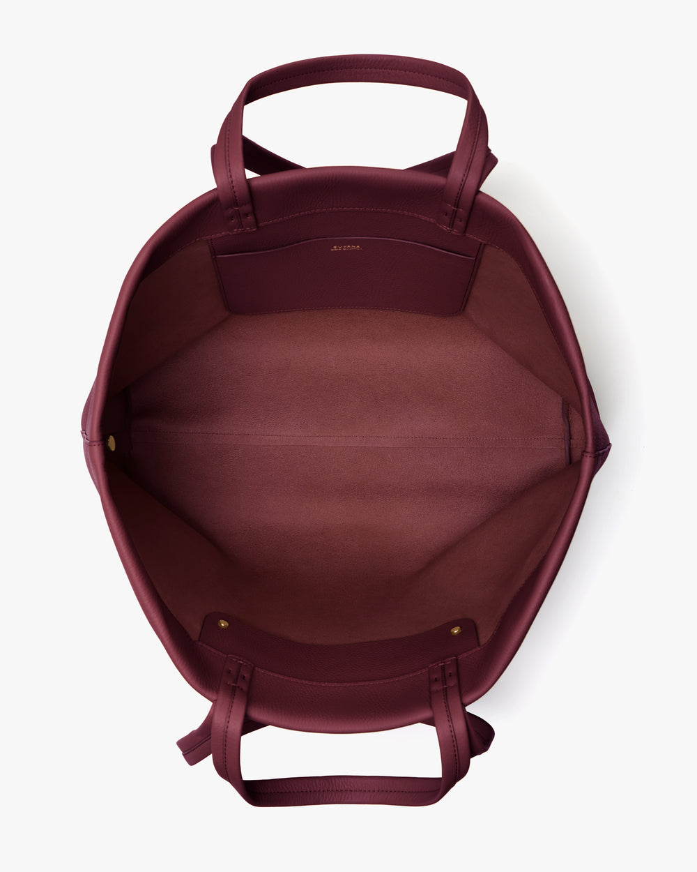 Open travel bag with handles, showing its empty interior and pocket.