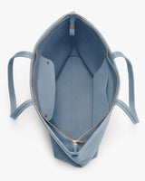 Open tote bag with two internal pockets and zip closure.