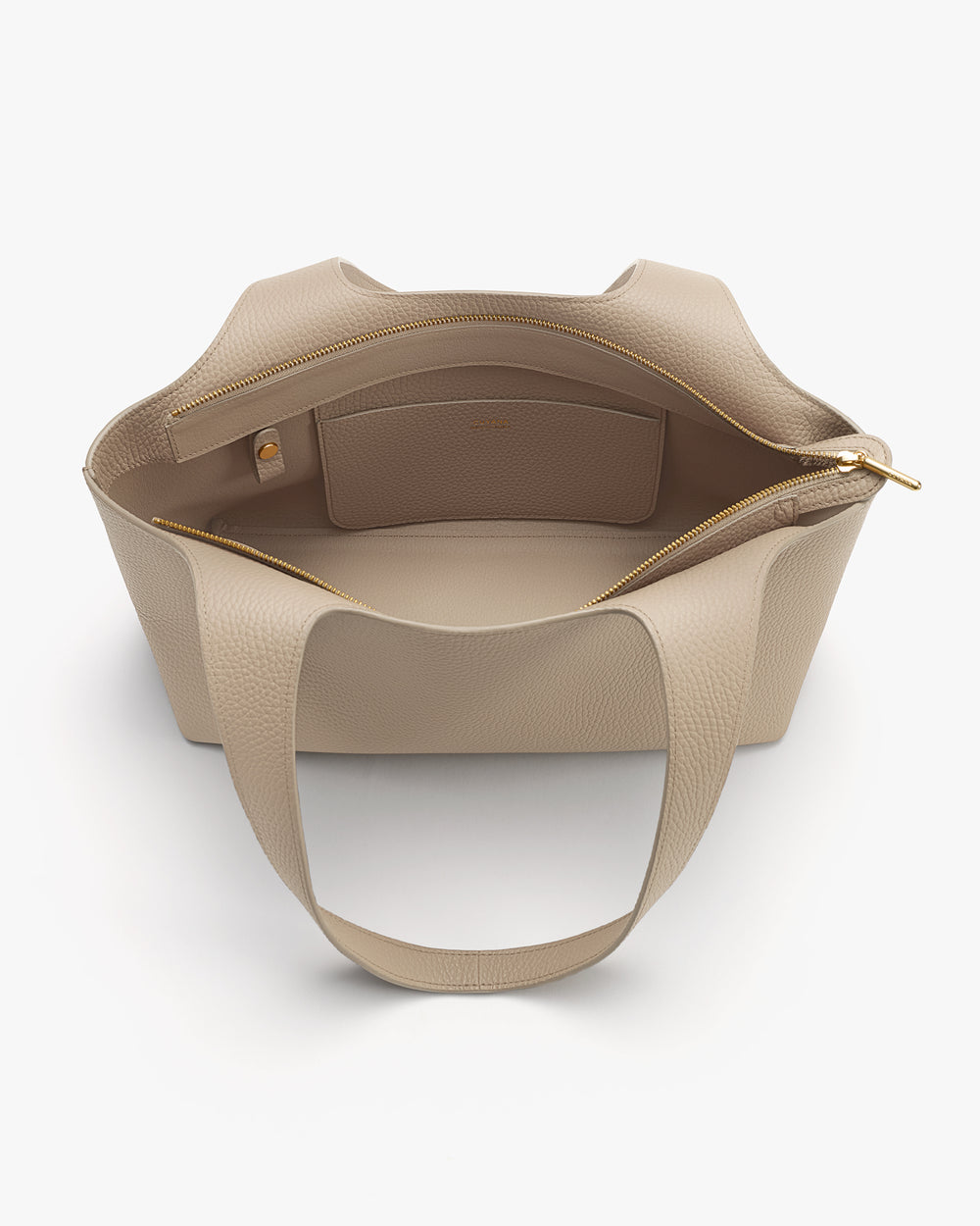Open tote bag with a large compartment and a zippered pocket inside.