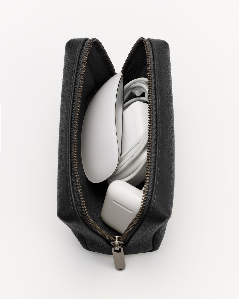Open pouch with electronic items and cords inside.