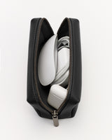 Open pouch with electronic items and cords inside.