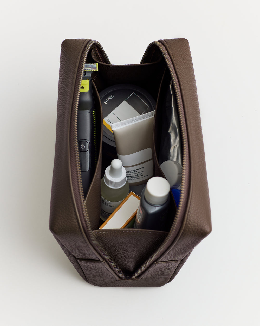 Toiletry bag containing various grooming products.