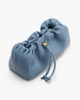 Soft pouch bag with drawstring closure.