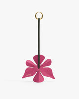 Flower-shaped leather keychain with a long strap and a gold ring.