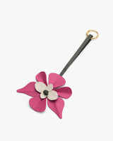 Flower-shaped keychain with a ring and a strap.