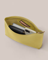 Open zippered purse containing phone, wallet, and lipstick.