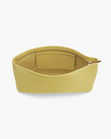 Open clutch bag with zipper and interior pocket facing up.