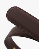 Close-up of a leather belt with stitching detail.