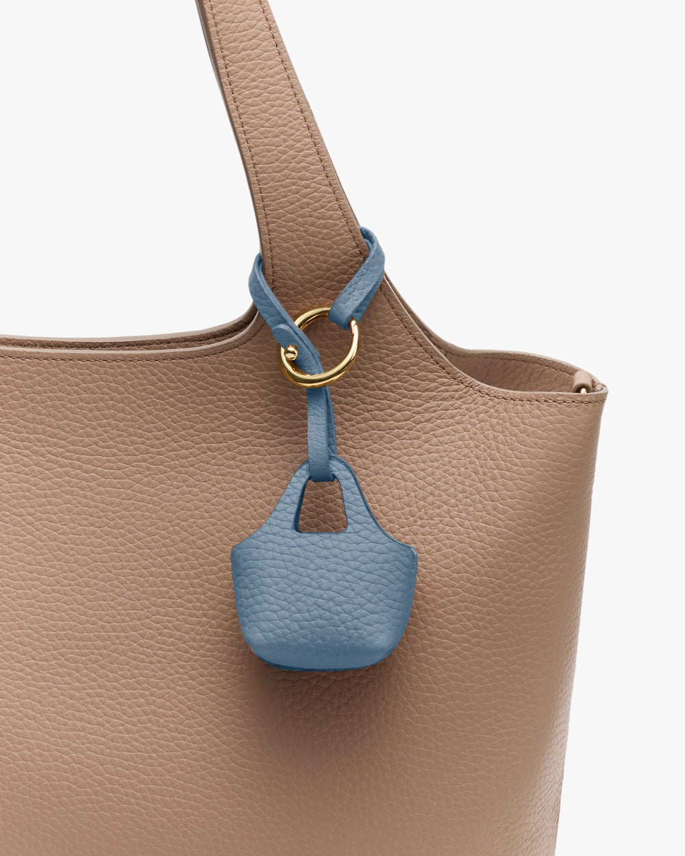 Tote bag with a small pouch attached to the handle via a gold ring.