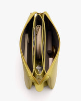 Open handbag showing organized compartments with various items inside.