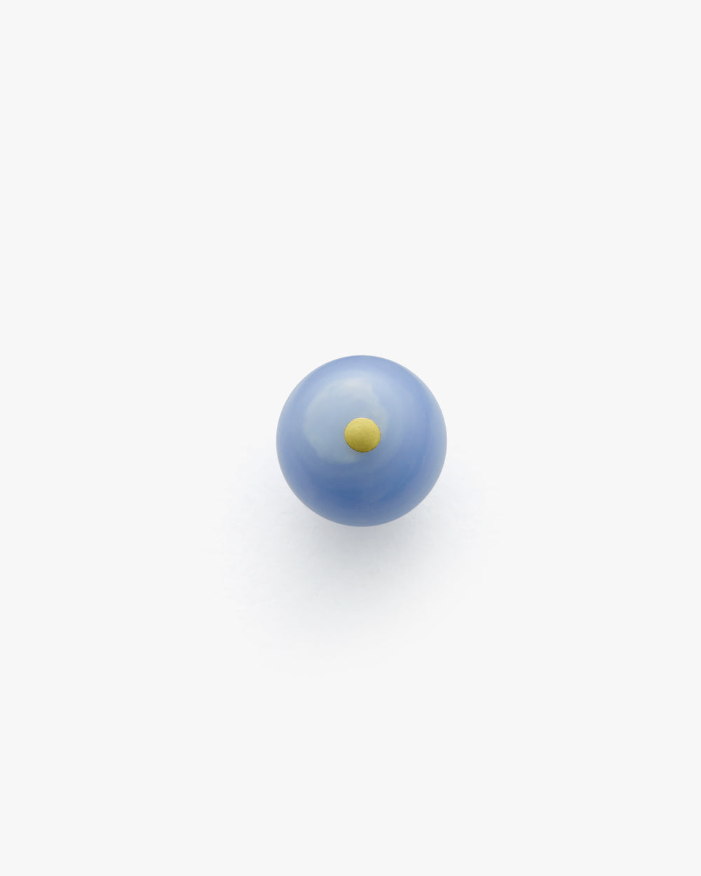 Blue marble with a small yellow dot in the center.