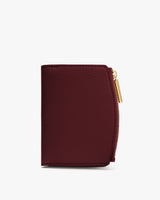 Small wallet with zipper closure on the side