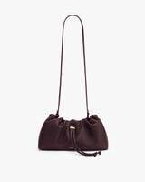 Shoulder bag with drawstring closure and long strap
