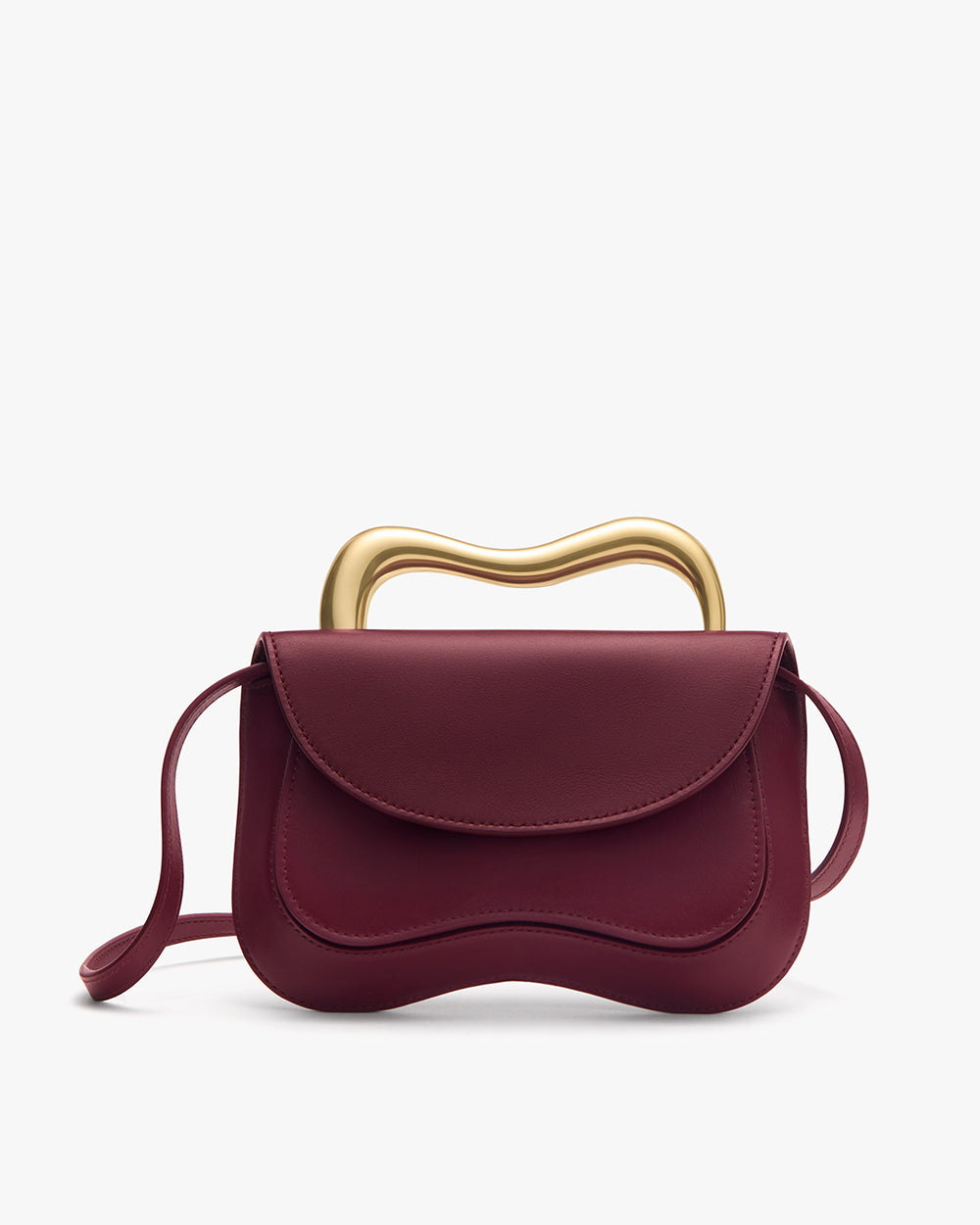 Handbag with wavy metallic handle and long strap.