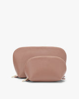Two pouches of varying sizes on a plain background.
