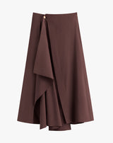 Asymmetrical wrap skirt with draped detail.