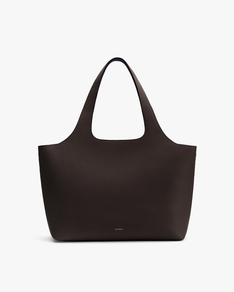 Tote bag with a subtle texture and simple design.