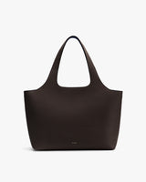 Tote bag with a subtle texture and simple design.