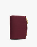 Small leather wallet with zippered closure on the right side