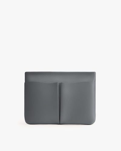 Rectangular clutch with front pouch pocket.