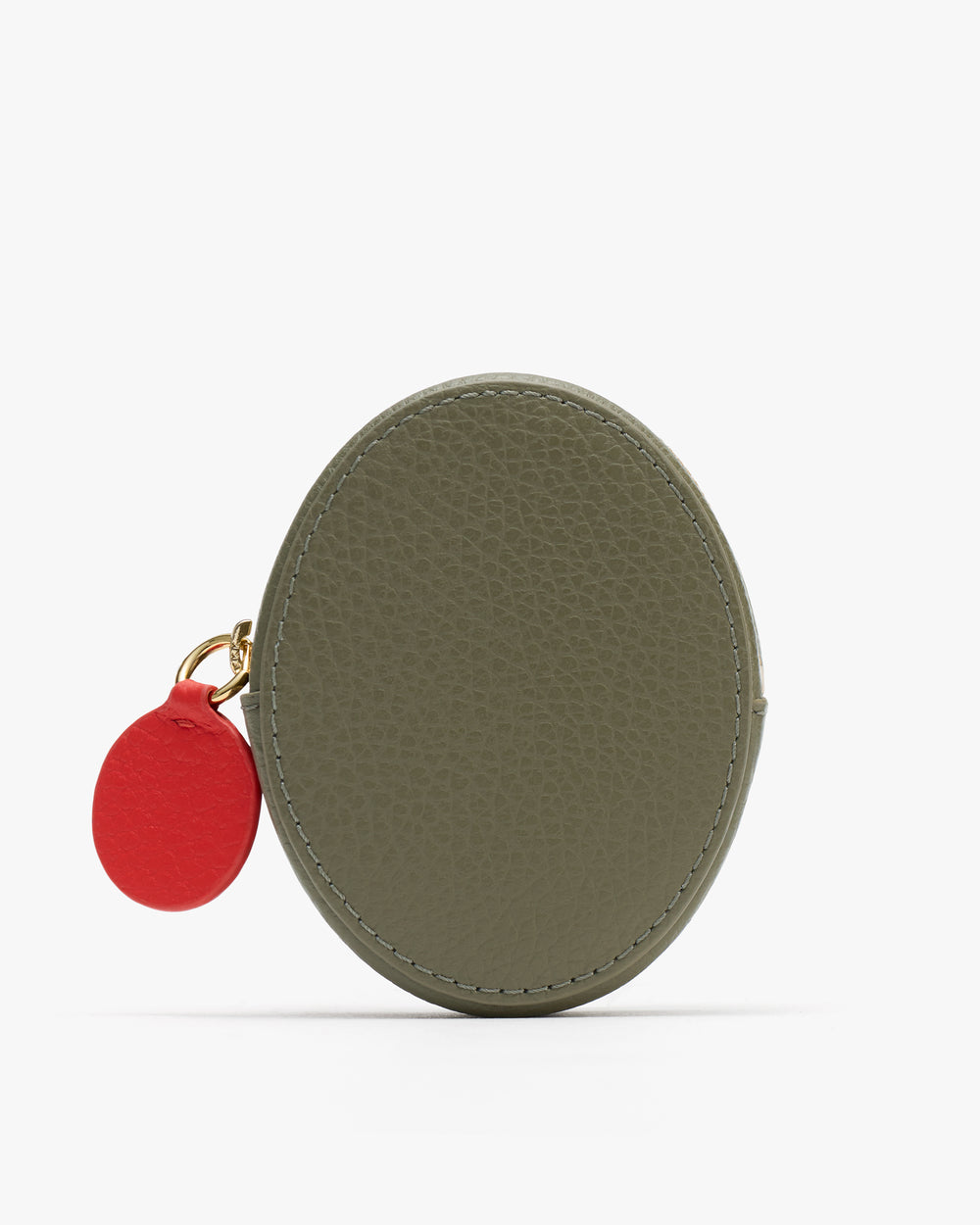 Oval-shaped coin purse with a small round tag attached.