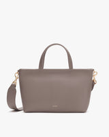 Handbag with short handles and detachable long strap.