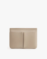 Rectangular clutch with a central seam and exterior pockets.