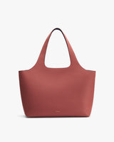 Tote bag with pebbled texture and wide handles.