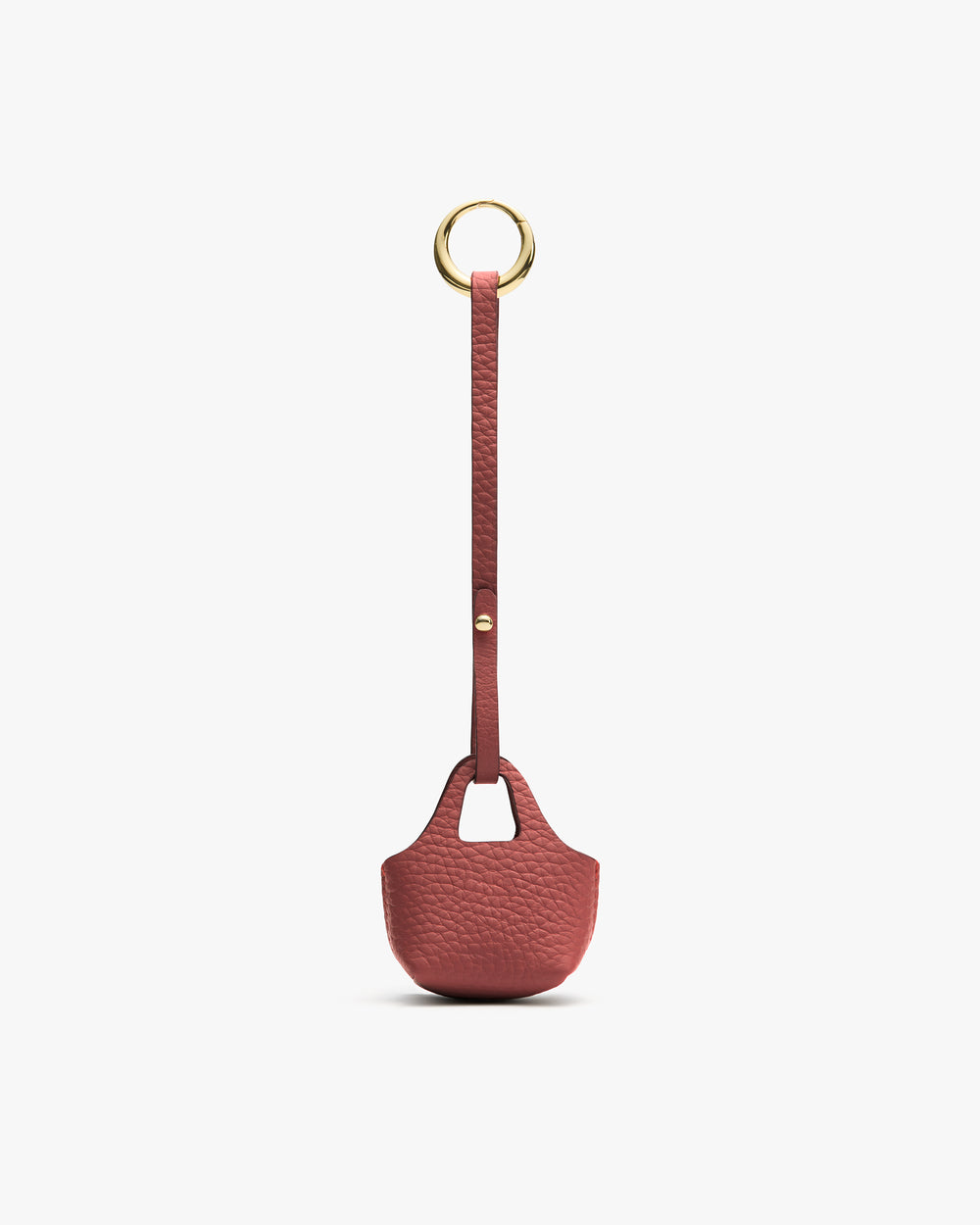 Small textured pouch with a long strap and circular metal ring.