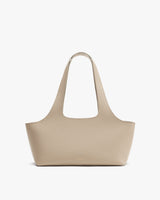 Tote bag with wide handles on display.