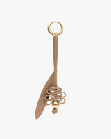 Keychain with looped leather design and metal ring.