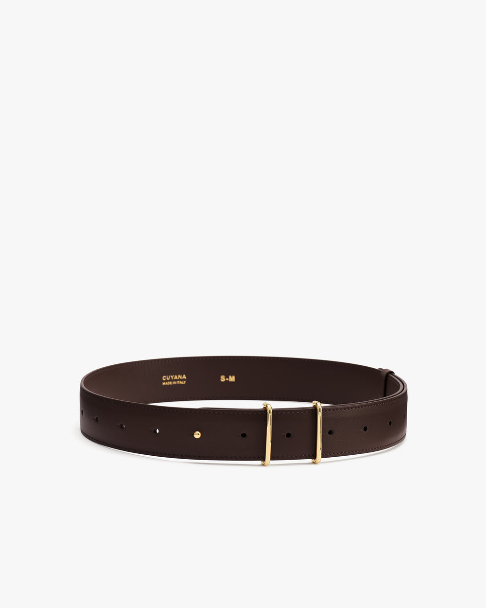 Leather belt with gold buckle and multiple holes laid flat.