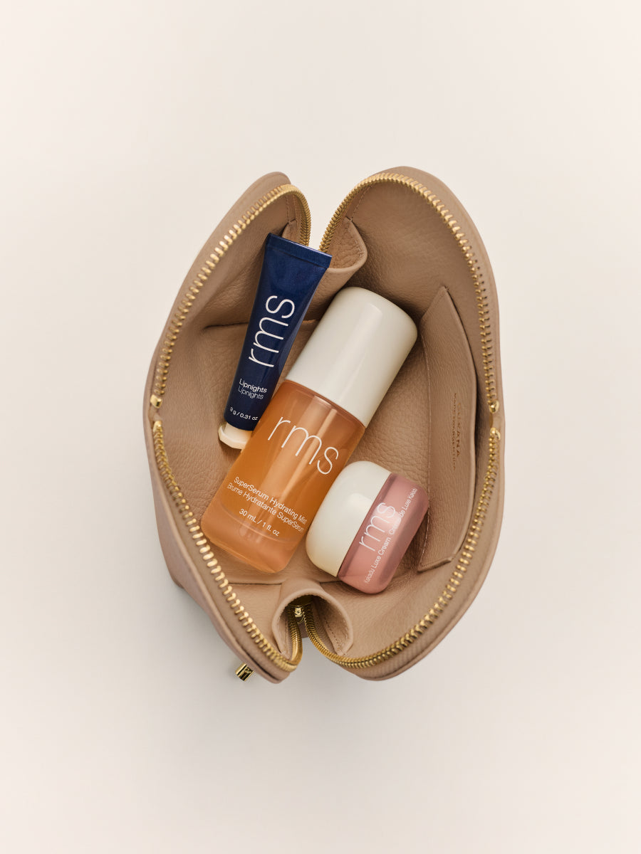 Open makeup pouch with skincare products inside.