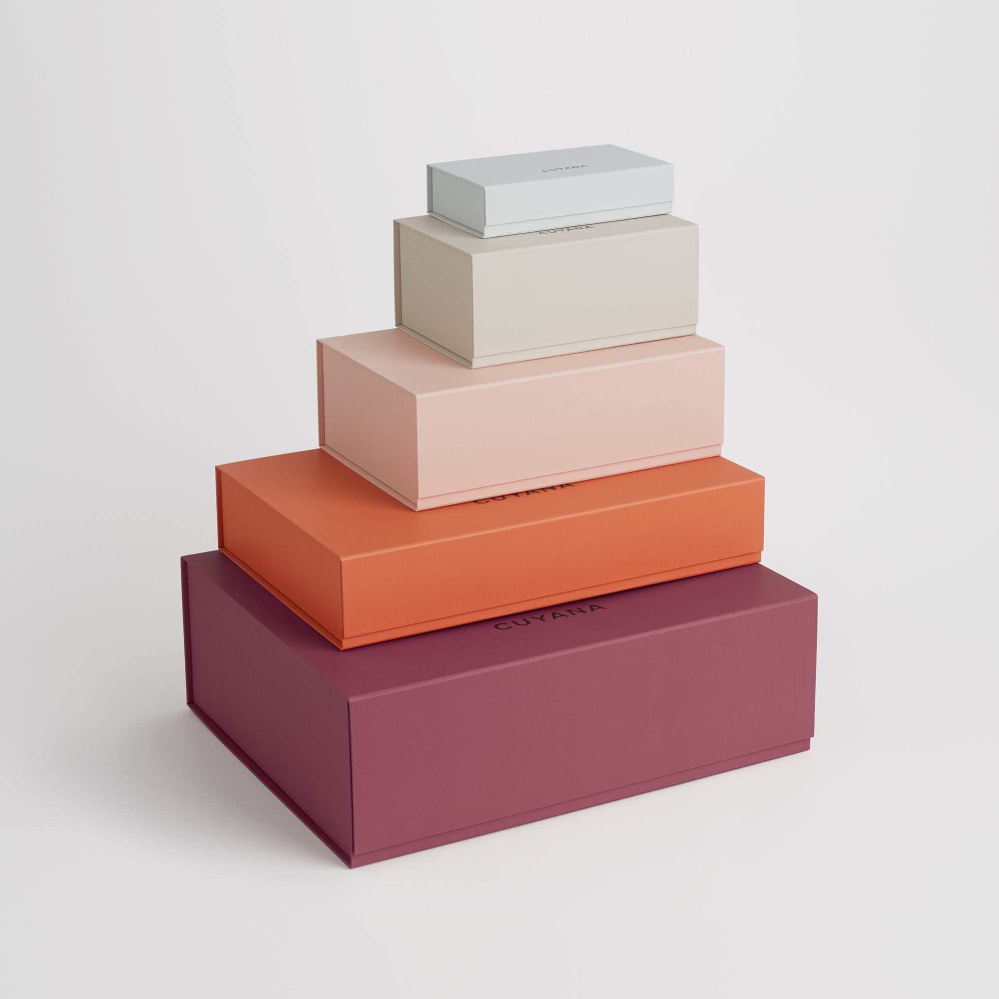 Stack of four nested rectangular boxes of varying sizes.