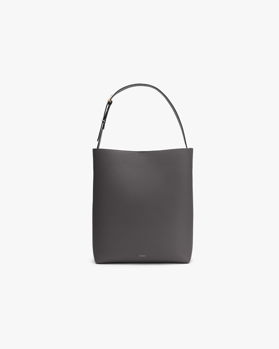 Vertical tote bag with a single shoulder strap